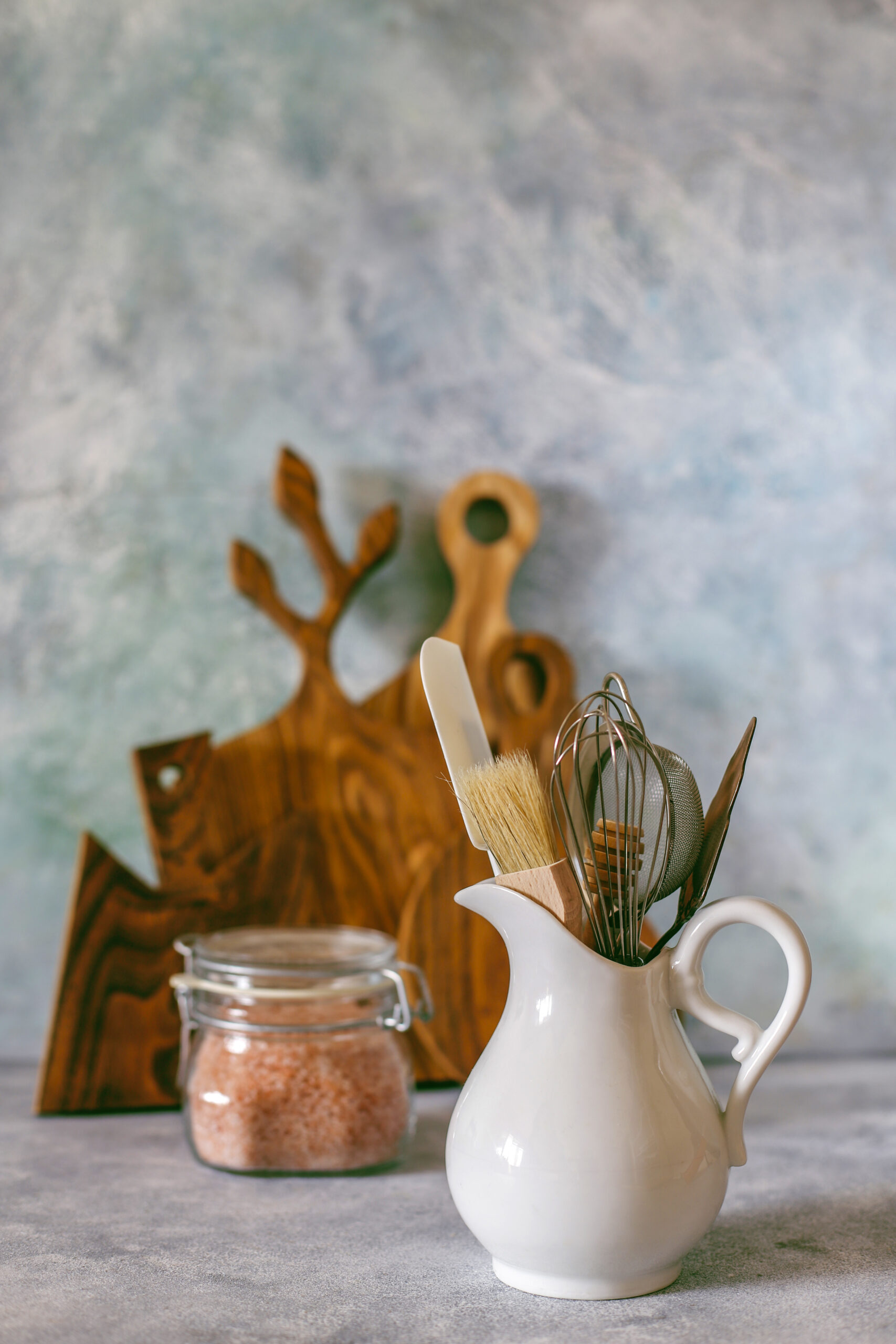 Kitchen shelf with various herbs, spices,seeds,legumes,cutting b